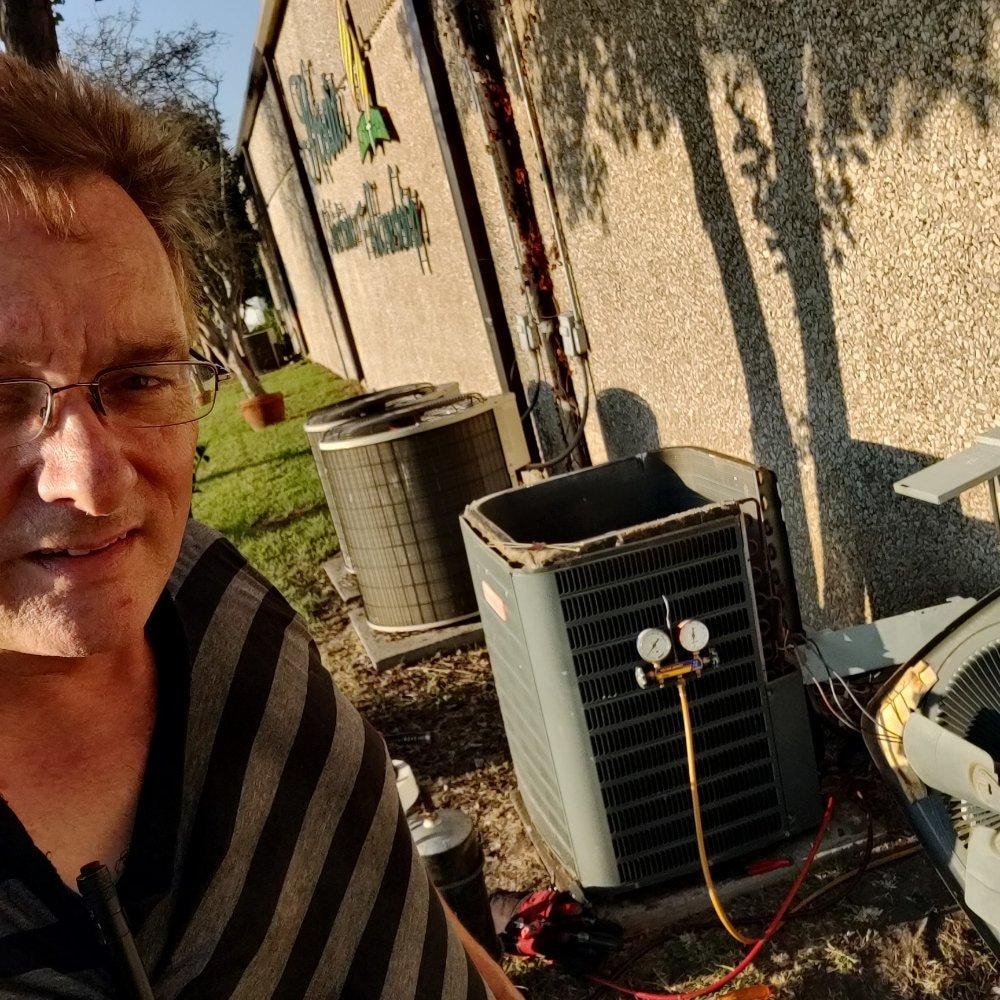 HVAC technician with air conditioning units