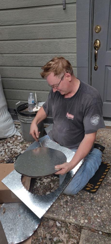 Technician installing roof flashing material